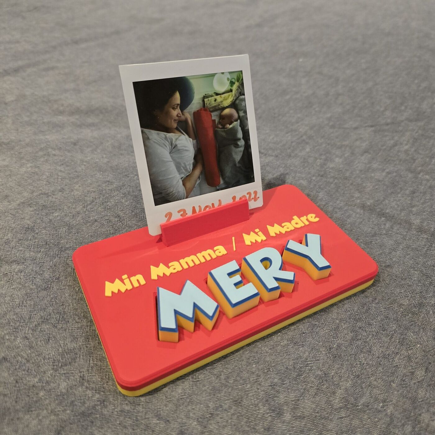 Angled view of a printed name board showing the depth of the letter tiles